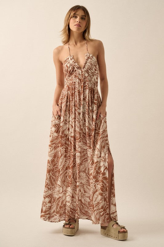 Halter Style Maxi Dress in a taupe floral print with back tie and side pockets