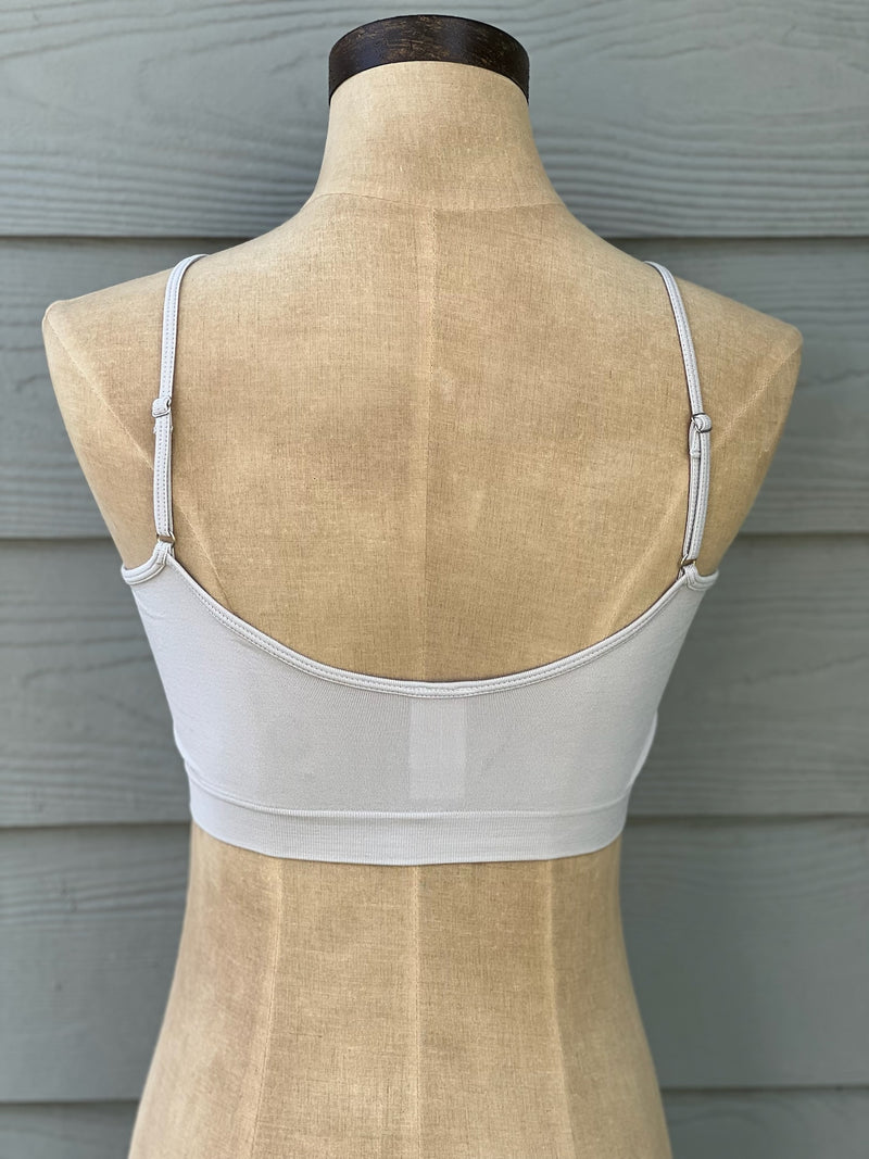 Silver bralette with criss cross front, adjustable straps and removable padding