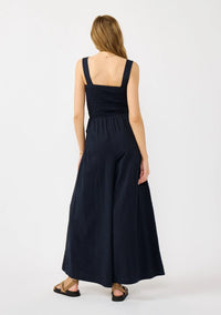 WIDE LEG SMOCKED BODICE COTTON JUMPSUIT IN DEEP NAVY WITH SIDE POCKETS