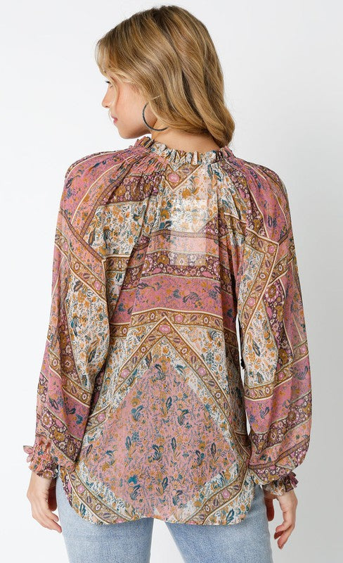PRINT PEASANT BLOUSE in shades of mauve, cream, gold and blue with long sleeves and smocking at wrists