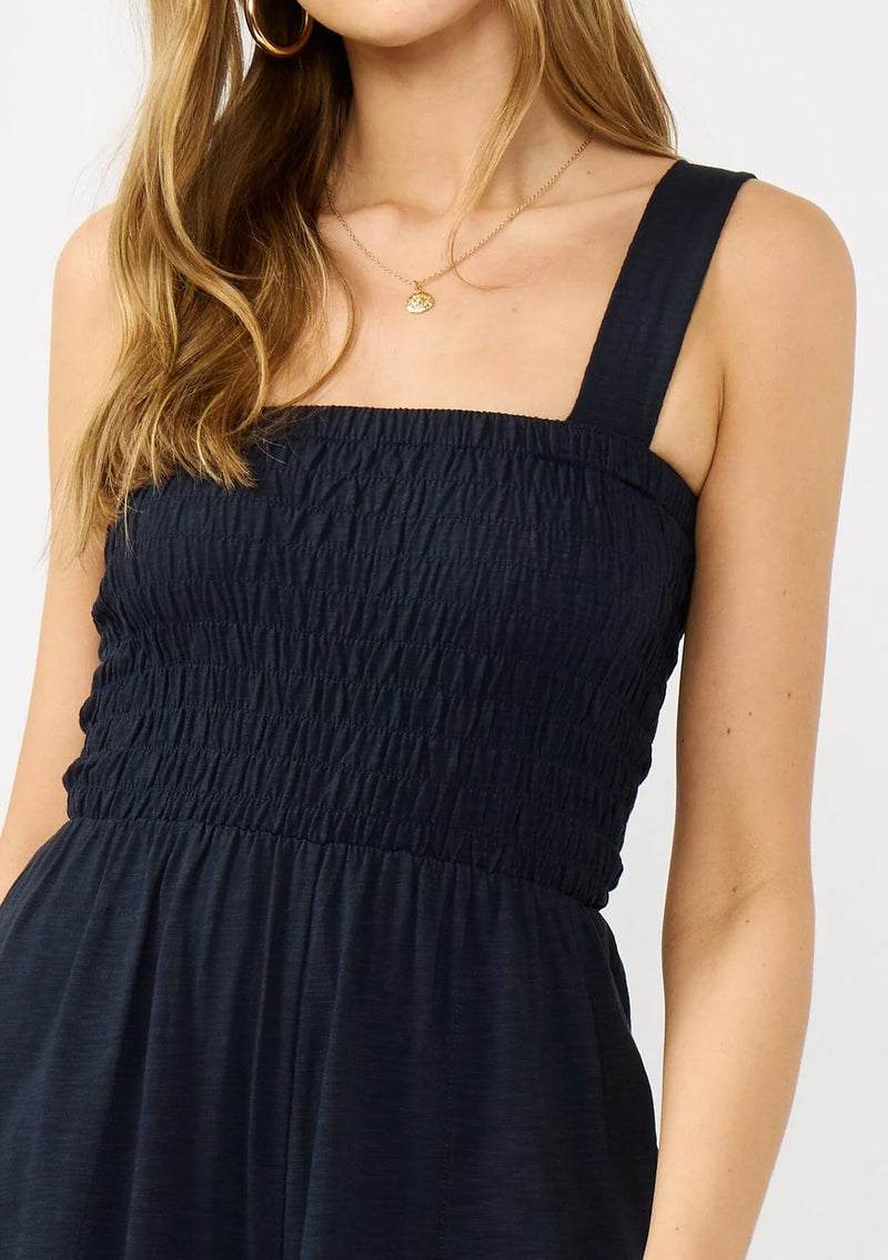 WIDE LEG SMOCKED BODICE COTTON JUMPSUIT IN DEEP NAVY WITH SIDE POCKETS