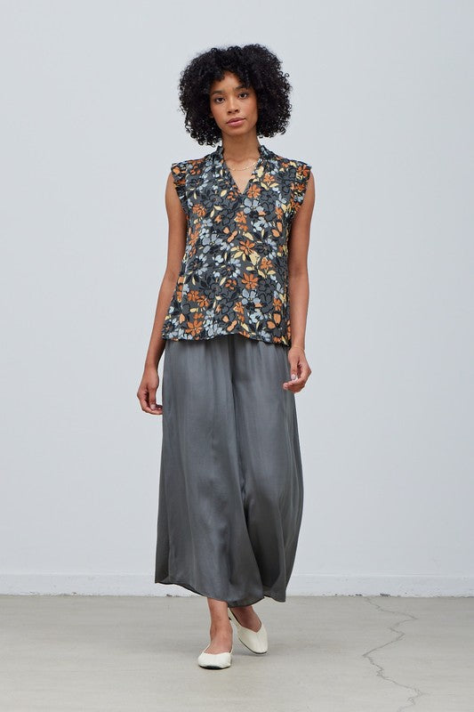 FLORAL SATIN RUFFLE SLEEVE BLOUSE on a slate background with floral print in shades of mustard, apricot and lt. gray. 