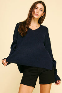 female wearing a V-Neck Navy Pullover with long sleeves and ribbed cuffs and hem