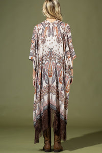 back of woman wearing Lightweight Kimono
Mixed Paisley Pattern Print in shades of beige, orange, blues
Long Fringe at the Bottom
Open Front
Side Slits