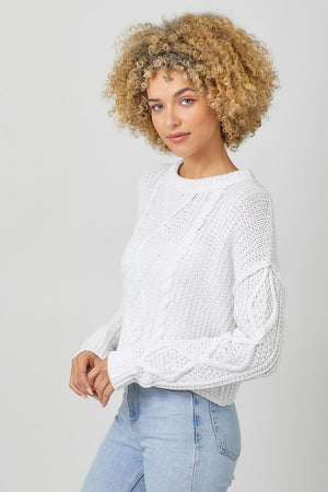 WHITE CABLE KNIT SWEATER WITH RAW EDGE HEM, ROUND NECKLINE, LONG SLEEVES