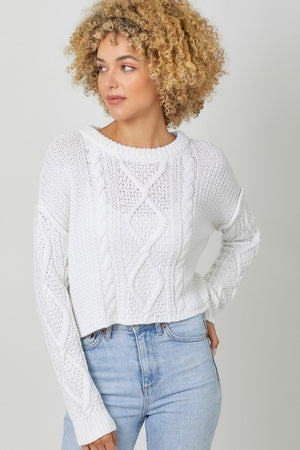 WHITE CABLE KNIT SWEATER WITH RAW EDGE HEM, ROUND NECKLINE, LONG SLEEVES