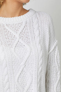 WHITE CABLE KNIT SWEATER WITH RAW EDGE HEM, ROUND NECKLINE, LONG SLEEVES