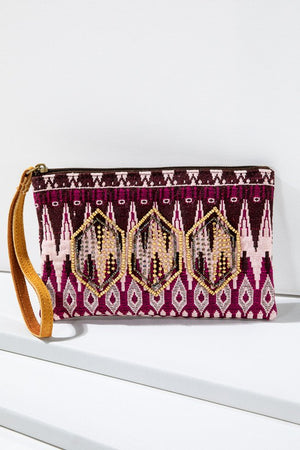 Ethnic Pattern Wristlet in shades of Fuchsia/Pink/Eggplant with gold and bronze seed beading and zipper closure