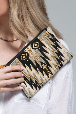 "Wren" Ethnic Pattern Wristlet in shades of Black/Gold/Natural with gold seed beading and zipper closure