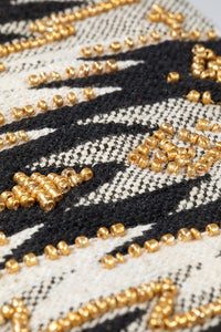 "Wren" Ethnic Pattern Wristlet in shades of Black/Gold/Natural with gold seed beading and zipper closure