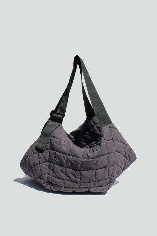 Charcoal quilted tote bag with adjustable "seatbelt" strap, zipper closure and interior wall pockets