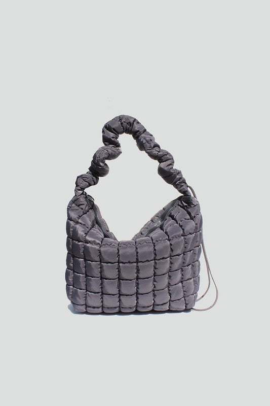 Gray nylon quilted crossbody bag with adjustable drawstring strap, zipper closure and interior wall pockets. 