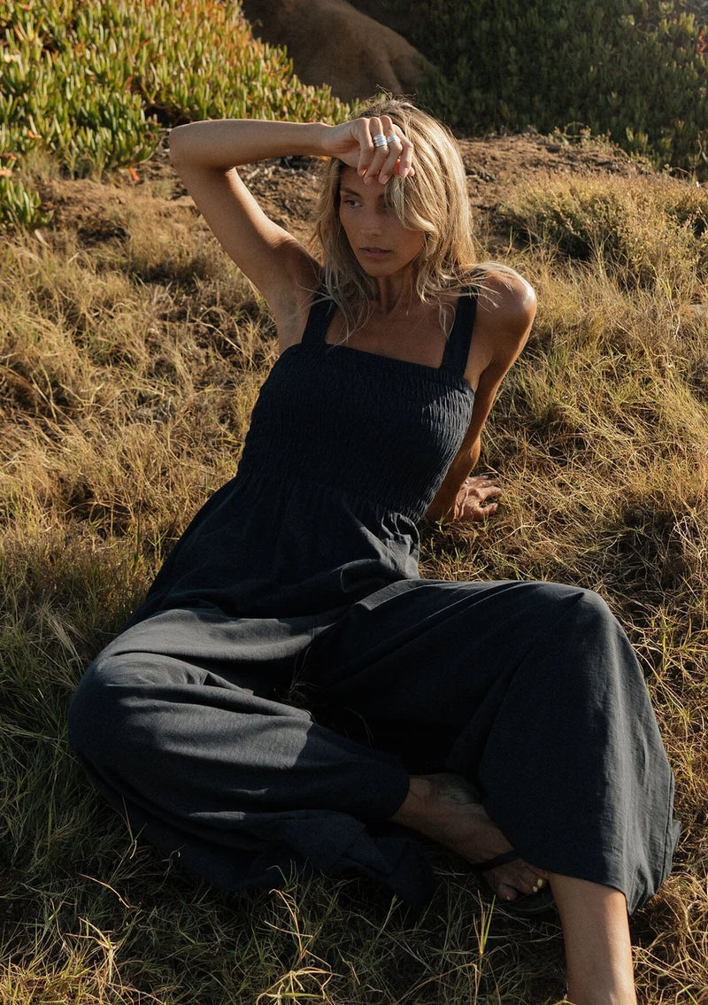 WIDE LEG SMOCKED BODICE COTTON JUMPSUIT IN DEEP NAVY WITH SIDE POCKETS