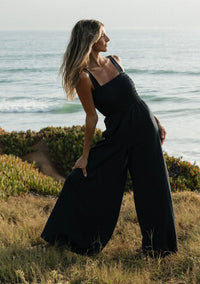 WIDE LEG SMOCKED BODICE COTTON JUMPSUIT IN DEEP NAVY WITH SIDE POCKETS
