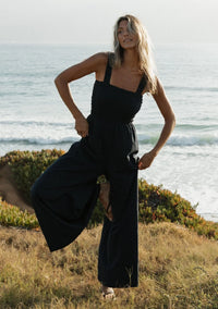 WIDE LEG SMOCKED BODICE COTTON JUMPSUIT IN DEEP NAVY WITH SIDE POCKETS