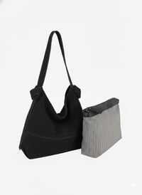 Genuine suede hobo style bag in black with large, removable zipper pouch, and suede shoulder strap
