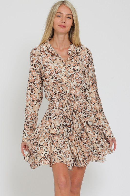 LONG SLEEVED FLORAL FLIRTY SKIRT MINI DRESS IN A FLORAL PRETTY IN SHADES OF BROWN AND BEIGE.  DRAWSTRING TIE AT WAIST.