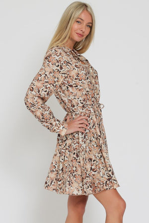 LONG SLEEVED FLORAL FLIRTY SKIRT MINI DRESS IN A FLORAL PRETTY IN SHADES OF BROWN AND BEIGE.  DRAWSTRING TIE AT WAIST.