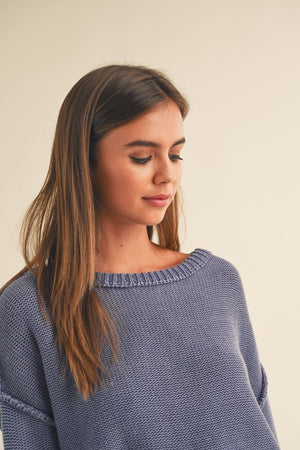 dye wash pull over sweater in denim blue with round crew neck, long sleeves, drop shoulders with exposed seams