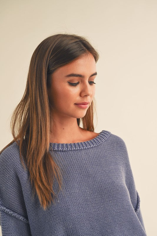 dye wash pull over sweater in denim blue with round crew neck, long sleeves, drop shoulders with exposed seams