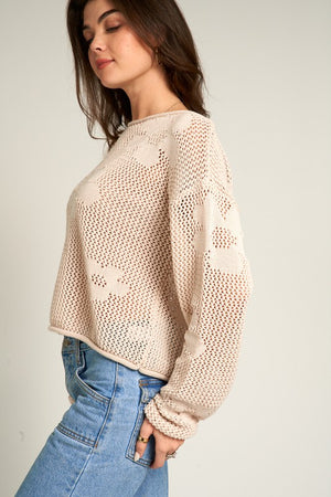 Beige flower pattern crochet sweater with rolled edge at neckline, sleeves and waist