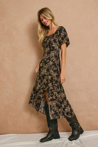 High slit midi dress with square neckline and elasticized sleeves that can be worn on or off the shoulder.  In dark brown with a cream floral print.