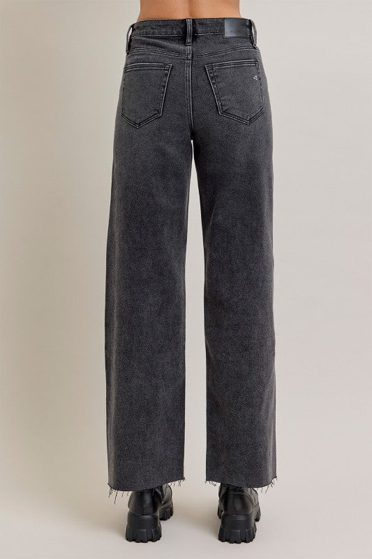 Black wide-leg jeans on a plain background, wide leg, full-length, raw edge hem