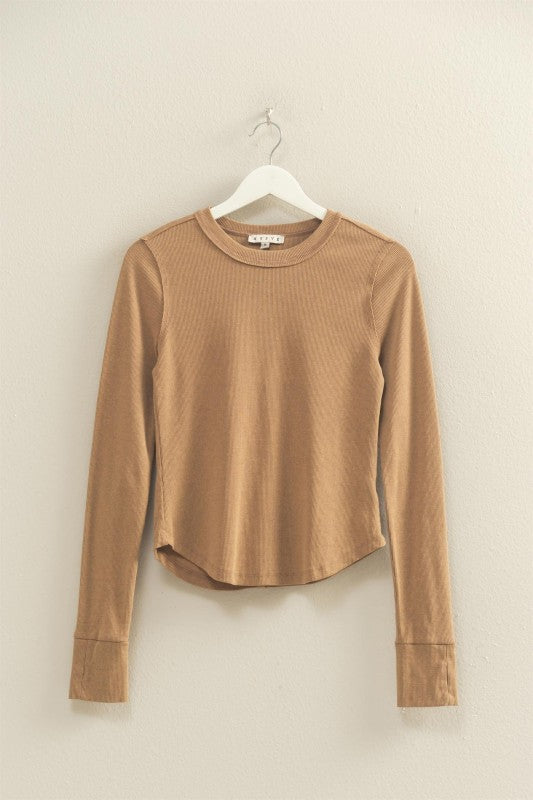 mineral washed taupe colored t-shirt with thumb hole long sleeves and reversed stitching around collar and shoulders, exposed seam down the back