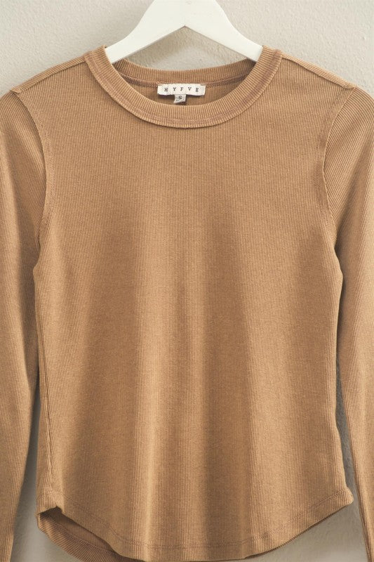 mineral washed taupe colored t-shirt with thumb hole long sleeves and reversed stitching around collar and shoulders, exposed seam down the back