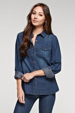 Dark wash snap front denim shirt with contrast stitch, collar and two front flap pockets.