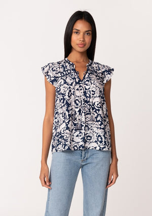FLUTTER SLEEVE BLOUSE IN A NAVY AND NATURAL COLOR PRINT WITH SPLIT V NECKLINE AND TASSEL TIES