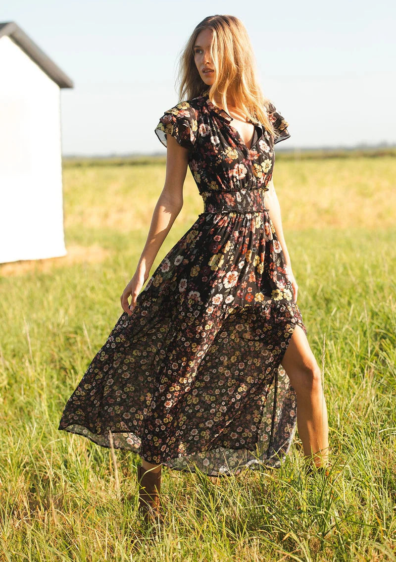 floral print maxi dress with front slit, ruffle short sleeves, contrast floral print on bottom, V-neck, smocked waist band, color is black with rose, ivory and green flower print. 