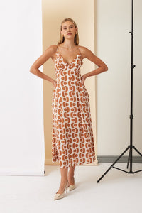 Printed Maxi Dress In Tobacco and Beige Print
V-Neckline
Open Tie Back
Hidden Side Pockets
Adjustable Spaghetti Straps
Fully Lined
