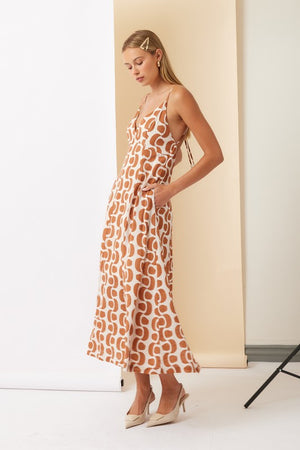 Printed Maxi Dress In Tobacco and Beige Print
V-Neckline
Open Tie Back
Hidden Side Pockets
Adjustable Spaghetti Straps
Fully Lined
