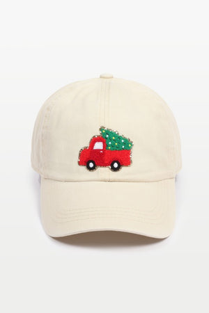Baseball cap with a chenille patch depicting an adorned Christmas Tree in a Vintage Truck in beige