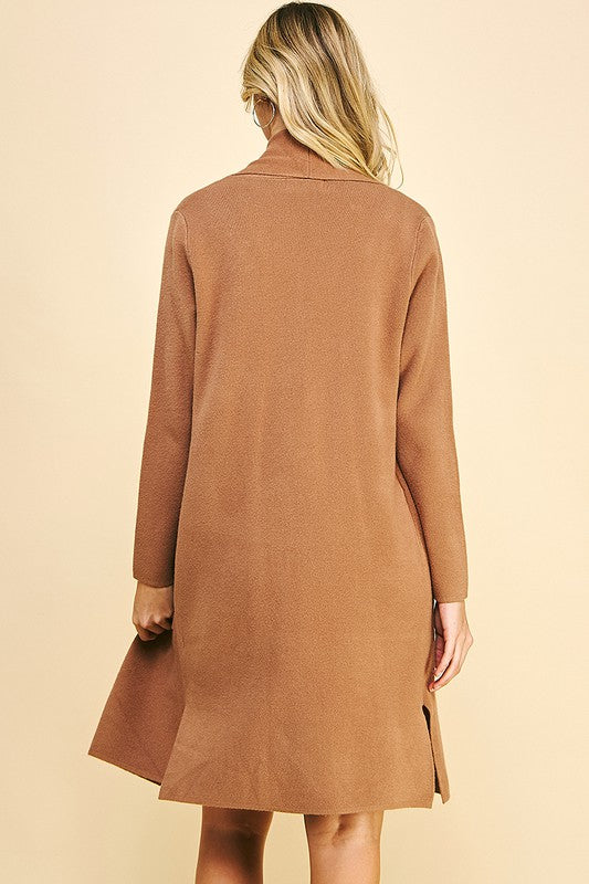 BACK VIEW OF OPEN FRONT KNITTED CARDIGAN, LONG SLEEVES, CAMEL COLOR WITH FRONT PATCH POCKETS