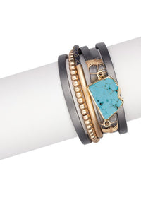 stackable leather wrapped bracelet with gold-tone beads and bar with a turquoise center piece and gold-tone magnetic clasp 