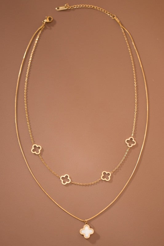 18K NON-TARNISH STAINLESS STEEL DOUBLE-STRAND NECKLACE , GOLD PLATED.  WHITE CLOVER PENDANT ON LONGER STRAND WITH LOBSTER CLAW CLOSURE. 18" W/ 2" EXTENDER