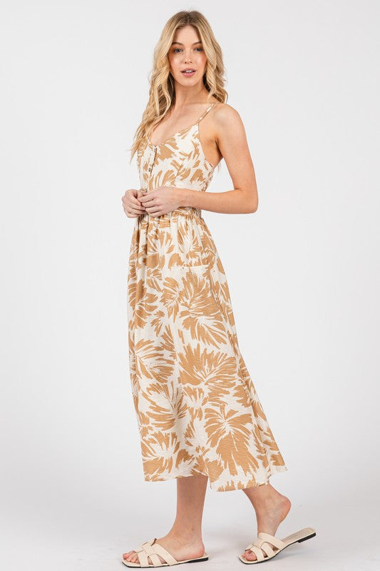 PATCH POCKET MIDI DRESS IN CREAM AND TAUPE GRAPHIC FLORAL PRINT WITH FUNCTIONAL FRONT BUTTONS AND ADJUSTABLE STRAPS
