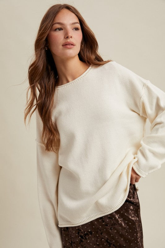 OFF WHITE OVERSIZED KNIT PULLOVER SWEATER w/ RAW EDGES AND REVERSE STITCHING AT SEAMS