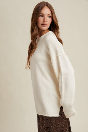 OFF WHITE OVERSIZED KNIT PULLOVER SWEATER w/ RAW EDGES AND REVERSE STITCHING AT SEAMS
