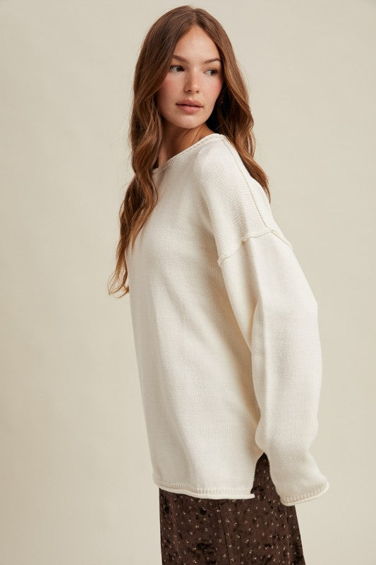 OFF WHITE OVERSIZED KNIT PULLOVER SWEATER w/ RAW EDGES AND REVERSE STITCHING AT SEAMS