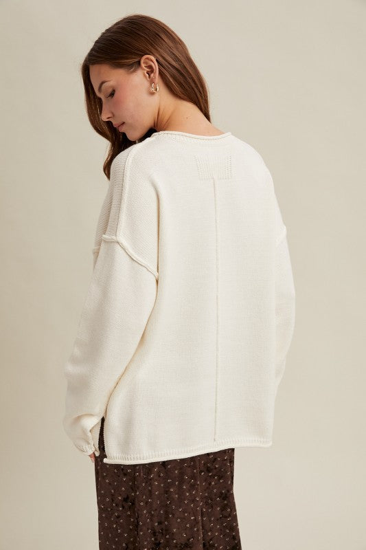OFF WHITE OVERSIZED KNIT PULLOVER SWEATER w/ RAW EDGES AND REVERSE STITCHING AT SEAMS