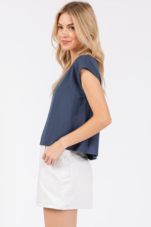 WOVEN BOXY TOP WITH EXTENDED SHORT SLEEVES AND ROUND NECKLINE