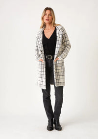 ultra-soft and fuzzy texture sweater coat with side pockets, a classic notched lapel, and a snap button front