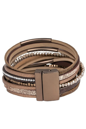 Multistrand bracelet with leather and beaded design on a white background