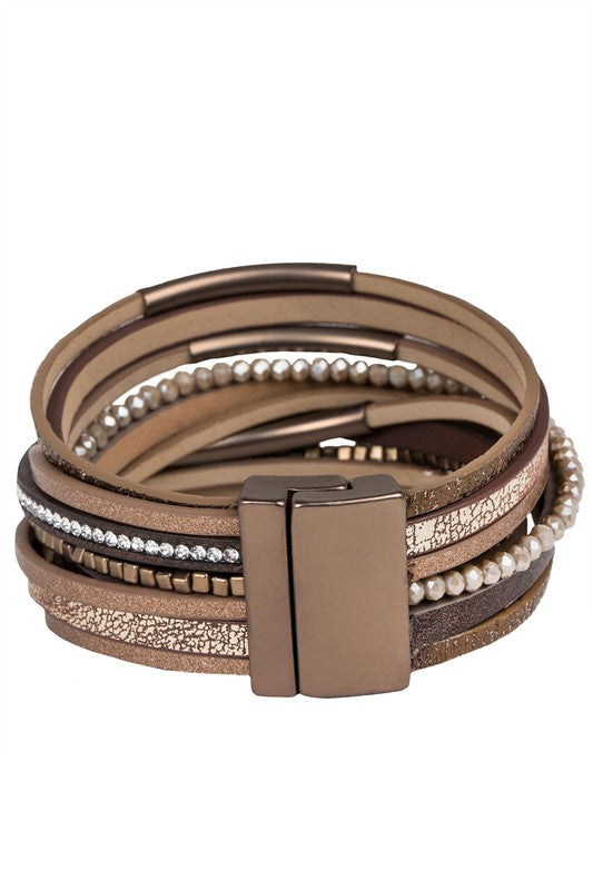Multistrand bracelet with leather and beaded design on a white background