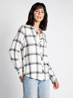 black and cream plaid collared shirt with one front pocket and long button cuffed sleeves l