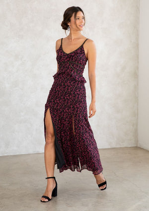Chiffon Maxi Dress Ditsy Floral Print Slim Fit Top Ruffled Waist Detail Flowy A-Line Skirt Thigh-High Side Slits Ruffle-Trimmed V-Neckline Subtle Gold Thread Trim Adjustable Spaghetti Straps Concealed Back Zipper Lining Attached Not Sheer Color:  Black/Raspberry