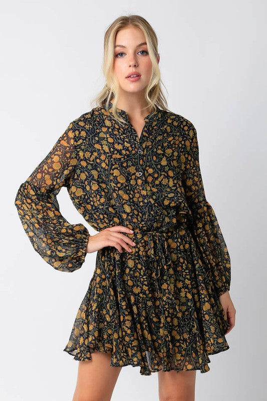FLORAL DRAWSTRING FLOUNCE HEM MINI DRESS in a dark navy floral print in mustard and olive